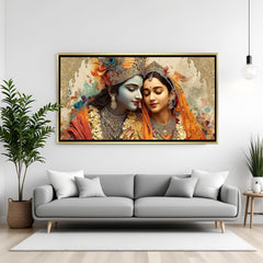 Luxury Radha Krishna wall art in gold frame with warm traditional colors and ornate detailing.