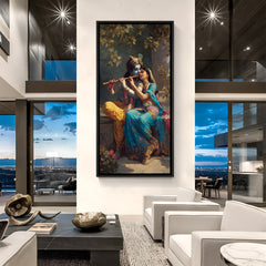 Framed Radha Krishna devotional wall art in black frame displayed in modern living room setting.