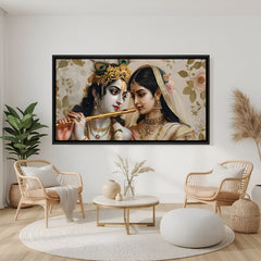 Elegant Radha Krishna devotional panorama in black frame displayed on teal wall.