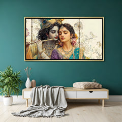 Elegant Radha Krishna wall art in gold frame with soft floral background.
