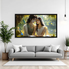 Radha Krishna devotional panorama artwork in black frame displayed on teal accent wall.