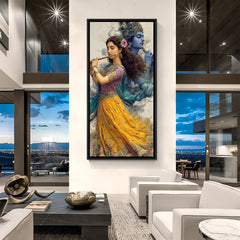 Framed Radha Krishna devotional wall art in black frame displayed in modern living space.