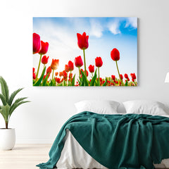 Canvas wall art of a blooming red tulip field under the sky, perfect for bold and scenic floral home decor