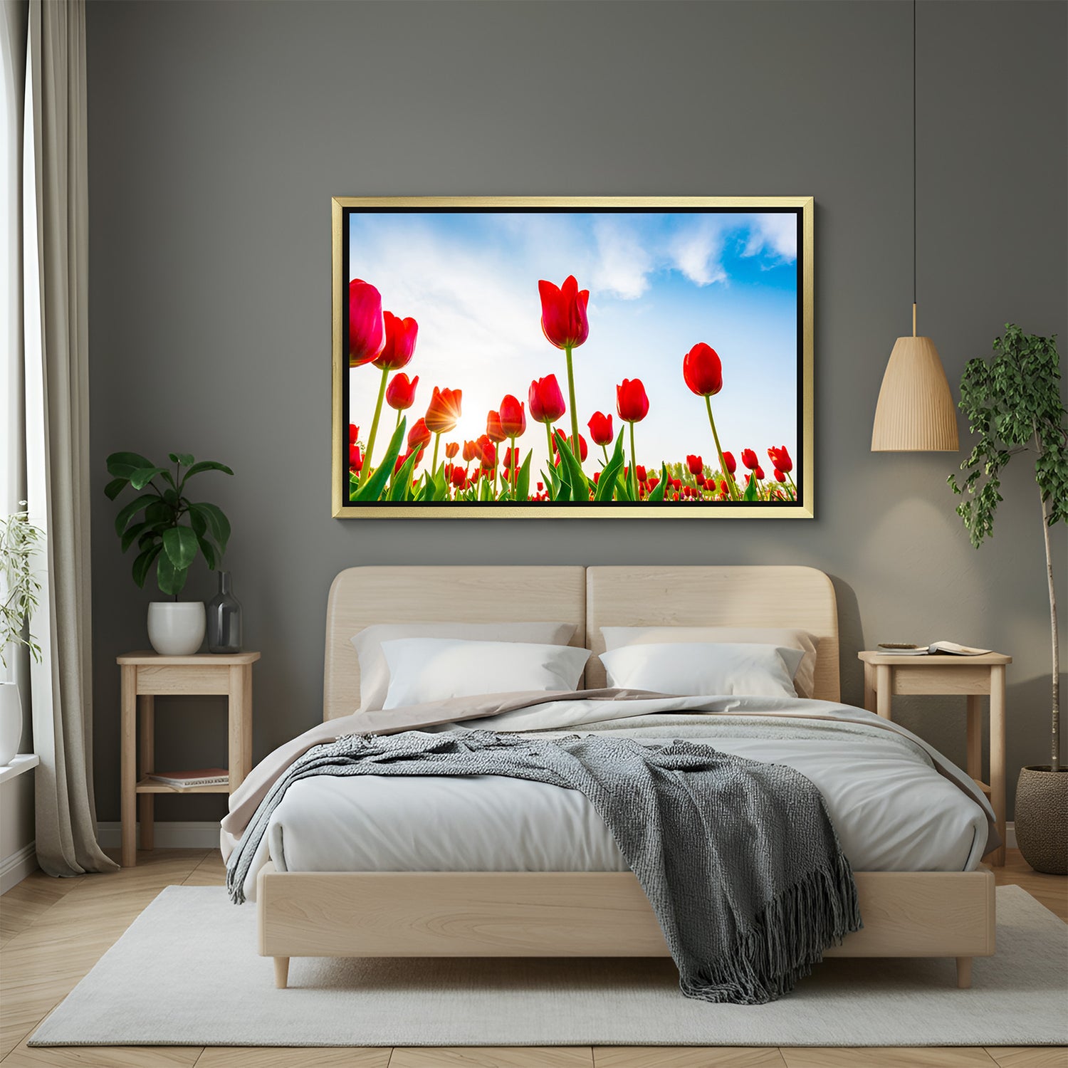 Golden-framed canvas print of red tulip flowers in a wide field, designed for luxury floral-themed wall decoration
