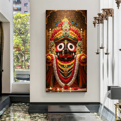 Canvas wrapped vertical Jagannath portrait wall art with red garlands, gold ornaments, and temple diya lights.