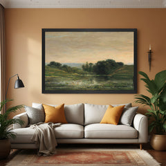 Black-framed canvas print of rustic landscape with green fields and weathered canvas look—vintage wall art