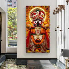 Canvas wrapped vertical portrait of Lord Jagannath adorned with marigold garlands, pearl jewelry, and golden halo backdrop.