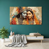 Panoramic Radha Krishna wall art featuring warm saffron tones, golden crown, and intricate jewelry detailing.