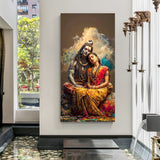Vertical Shiva Parvati canvas wall art showing divine couple seated together with detailed red saree and blue-toned Shiva against soft cloud background