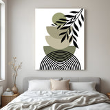 Boho canvas wall art with circular base lines, earthy U-shapes, green circle, and leaf stem