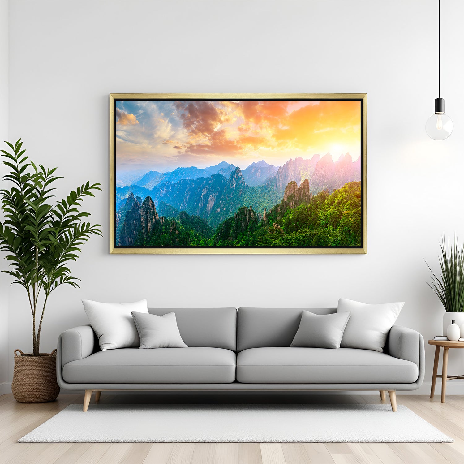 Glowing sunrise canvas print with rainbow-style sunlight over hills and mountains, displayed in golden floater frame for warm and peaceful home decor
