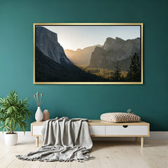 Canvas wall art of sunrise light on hillside landscape, displayed in a golden floater frame for warm and serene nature-inspired home decor