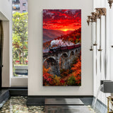 Sunset Railway Horizon canvas wall decor featuring a train crossing a bridge during a beautiful sunset in premium canvas wrapped frame
