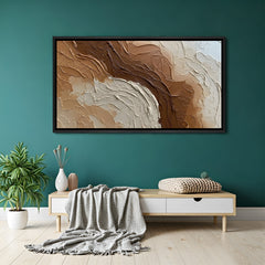 Earth tone abstract textured canvas wall art in brown and beige with black floater frame above sofa in contemporary living room decor