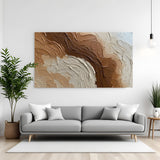 Textured neutral abstract canvas wall art in brown, beige, and white tones with palette knife effect displayed above sofa in modern living room canvas wrap decor