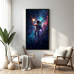 Astronaut motivational art in black flutter frame hanging on wall