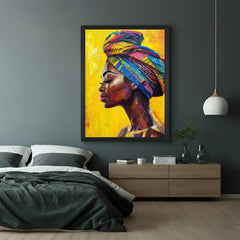 Framed canvas showing a woman in turban against a soft yellow painted background, in black floater frame for modern interiors