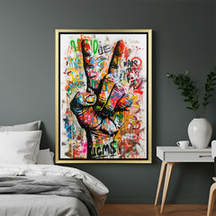 Golden-framed canvas print showing the iconic victory hand sign in altered painted style—perfect for adding symbolism and edge to modern and minimalist interiors