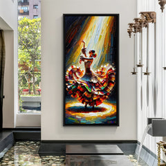 Hand-painted canvas wall art of a woman dancing in a colorful flowing dress in black floater frame